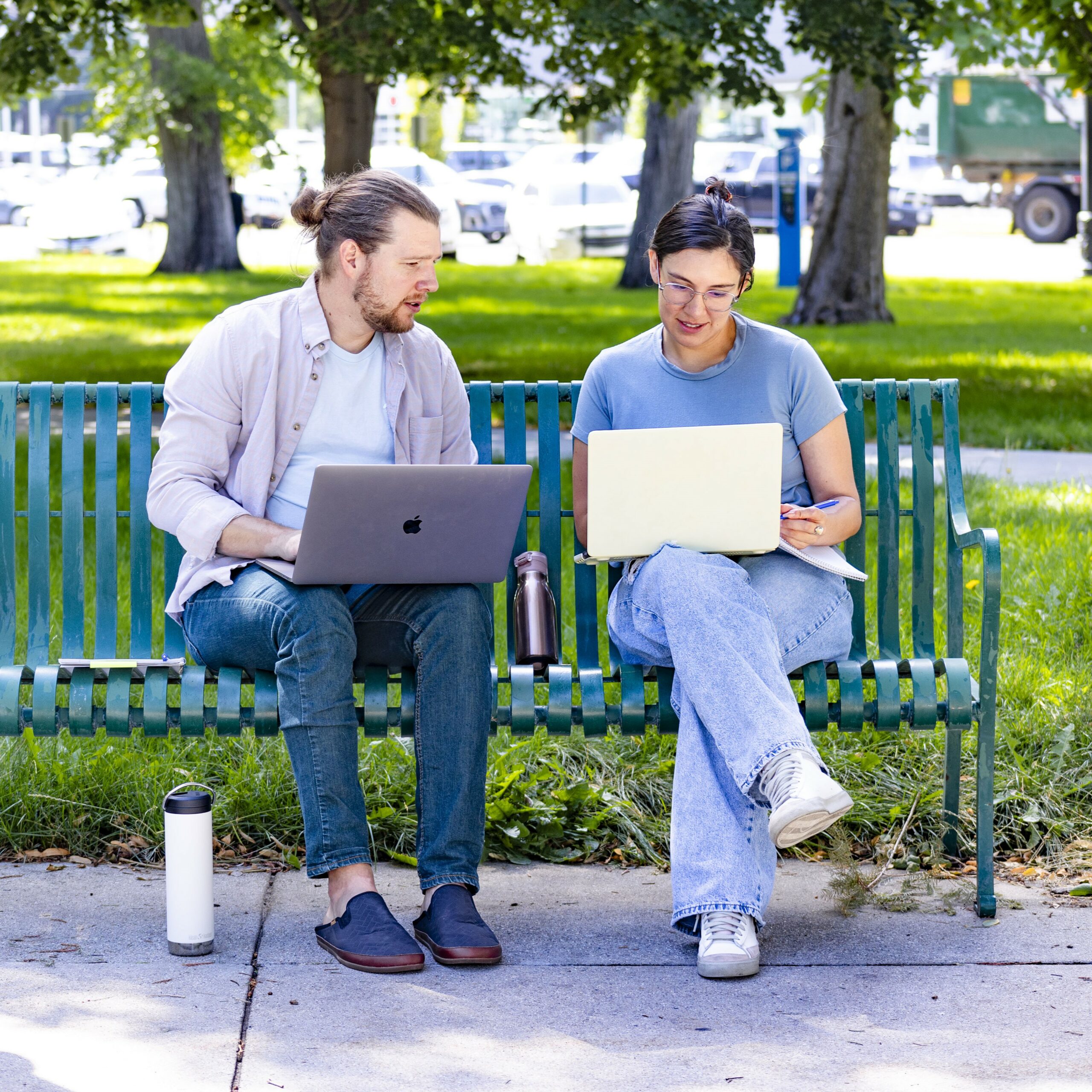 joyce university nursing student with peer tutor sitting on park bench